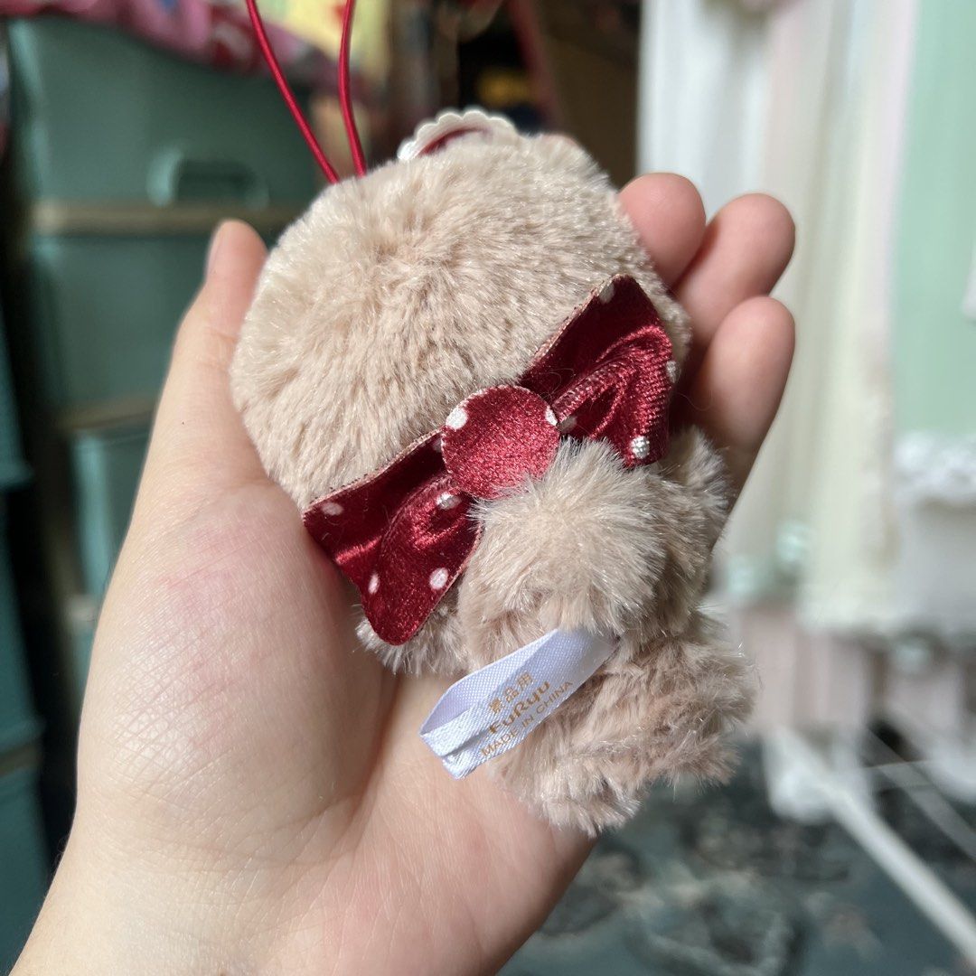 Sanrio Tiny Chum Plush Keychain with Red Bow (Category: Plushies & Soft Toys) located in Quezon City. Submitted by mei_declutters (Listing ID 1463402879, Image 2). Description: - Adorable furry bear keychain - Features a cute red bow with white polka dots on its head - Stylish white lace collar detail - Small red bow on the back - Includes a red string for easy hanging - Ideal accessory for bags, backpacks, and more!.