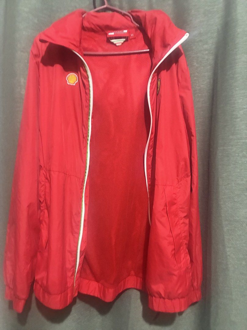 Unisex - Authentic Shell Ferrari Windbreaker (Category: Coats, Jackets and Outerwear) located in Rizal. Submitted by melowfashion_preloved (Listing ID 1463509075, Image 3). Description: Location: Rizal - Authentic Red Scuderia Ferrari jacket - Features iconic Shell and Ferrari logos - Includes a convenient hood - Full zip-up front for easy wear - Comfortable mesh lining inside - Size XS - Unisex - Ideal for any passionate Ferrari enthusiast .