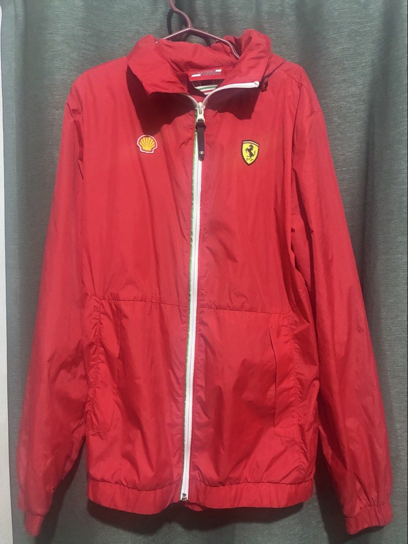 Unisex - Authentic Shell Ferrari Windbreaker (Category: Coats, Jackets and Outerwear) located in Rizal. Submitted by melowfashion_preloved (Listing ID 1463509075, Image 1). Description: Location: Rizal - Authentic Red Scuderia Ferrari jacket - Features iconic Shell and Ferrari logos - Includes a convenient hood - Full zip-up front for easy wear - Comfortable mesh lining inside - Size XS - Unisex - Ideal for any passionate Ferrari enthusiast .