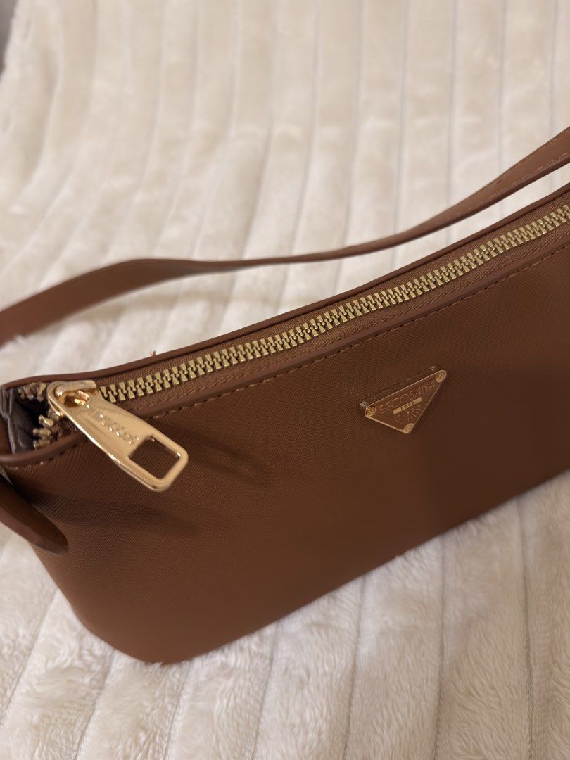 SECOSANA Tacey Petite Shoulder Bag (Tan) (Category: Luxury Bags & Wallets) located in Rizal. Submitted by rianaht (Listing ID 1463389113, Image 2). Description: SECOSANA Tacey Petite Shoulder Bag - Color: Brown / Tan - Material: Durable textured synthetic leather - Hardware: Gold-tone hardware and triangular Secosana emblem - Features: Zipper main closure, interior zipper pocket, and side slip pocket for organization - Condition: Excellent condit