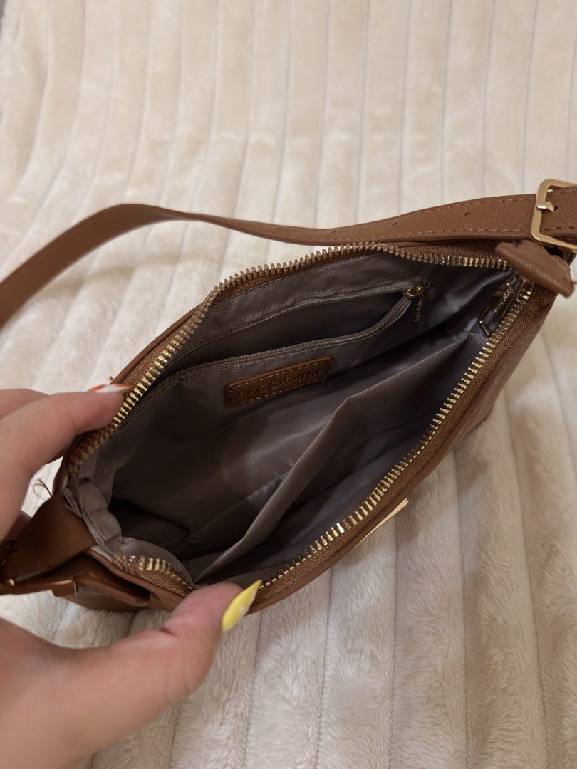 SECOSANA Tacey Petite Shoulder Bag (Tan) (Category: Luxury Bags & Wallets) located in Rizal. Submitted by rianaht (Listing ID 1463389113, Image 3). Description: SECOSANA Tacey Petite Shoulder Bag - Color: Brown / Tan - Material: Durable textured synthetic leather - Hardware: Gold-tone hardware and triangular Secosana emblem - Features: Zipper main closure, interior zipper pocket, and side slip pocket for organization - Condition: Excellent condit