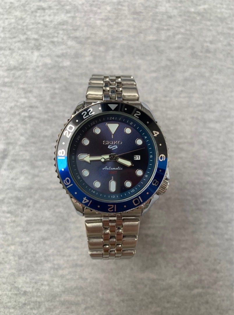 Seiko Five GMT BATMAN Automatic Open back (Category: Men's Watches) located in Manila. Submitted by jaivrgr22 (Listing ID 1463404345, Image 1). Description: Excellent Condition All Working / No issue With Hard Box & Paper Bag .