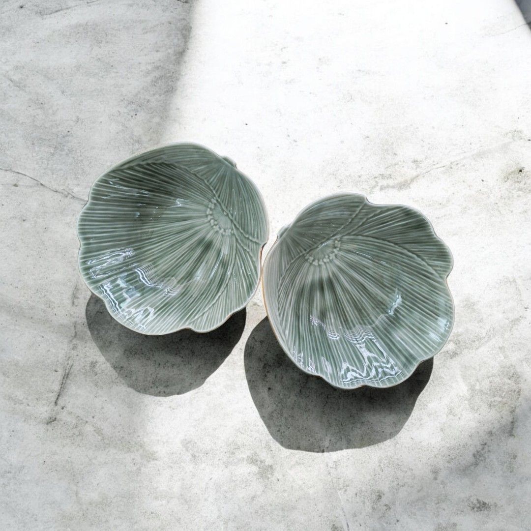 Set of 2 Leaf Shaped Serving Bowls - Green Ceramic (Category: Dinnerware & Cutlery) located in Tandag. Submitted by rareandfoundph (Listing ID 1463364990, Image 1). Description: A pair of vintage sage green ceramic bowls shaped like blooming flowers, featuring a glossy celadon finish and beautifully embossed petal details. A charming matching set for serving individual salads, soups, desserts, ice cream, or fruits. They can also be styled as jewe