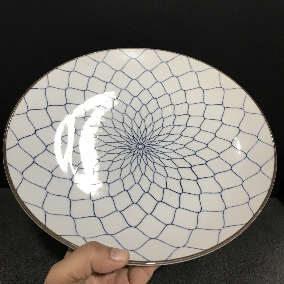 Set of 2 White Blue Patterned Ceramic Plates (Category: Dinnerware & Cutlery) located in Baao. Submitted by all.things.japan (Listing ID 1463366552, Image 3). Description: P240.00 each -Set of 2 beautiful ceramic plates - White base with a striking blue geometric pattern radiating from the center - Elegant subtle gold trim along the edges - Versatile: great for serving food or as decorative display pieces - One plate features a blue stamp on the 