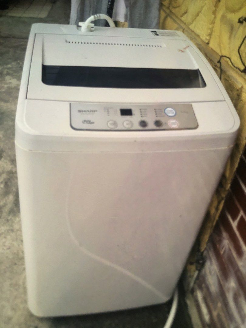Sharp Top Load Washing Machine (Category: Washing Machines and Dryers) located in Paranaque City. Submitted by luxthings.etc. (Listing ID 1463538231, Image 1). Description: - Sharp Top Load Washing Machine - Color: White - Features a digital display panel with buttons - Standard household size - Works perfectly - Ready for a new home.