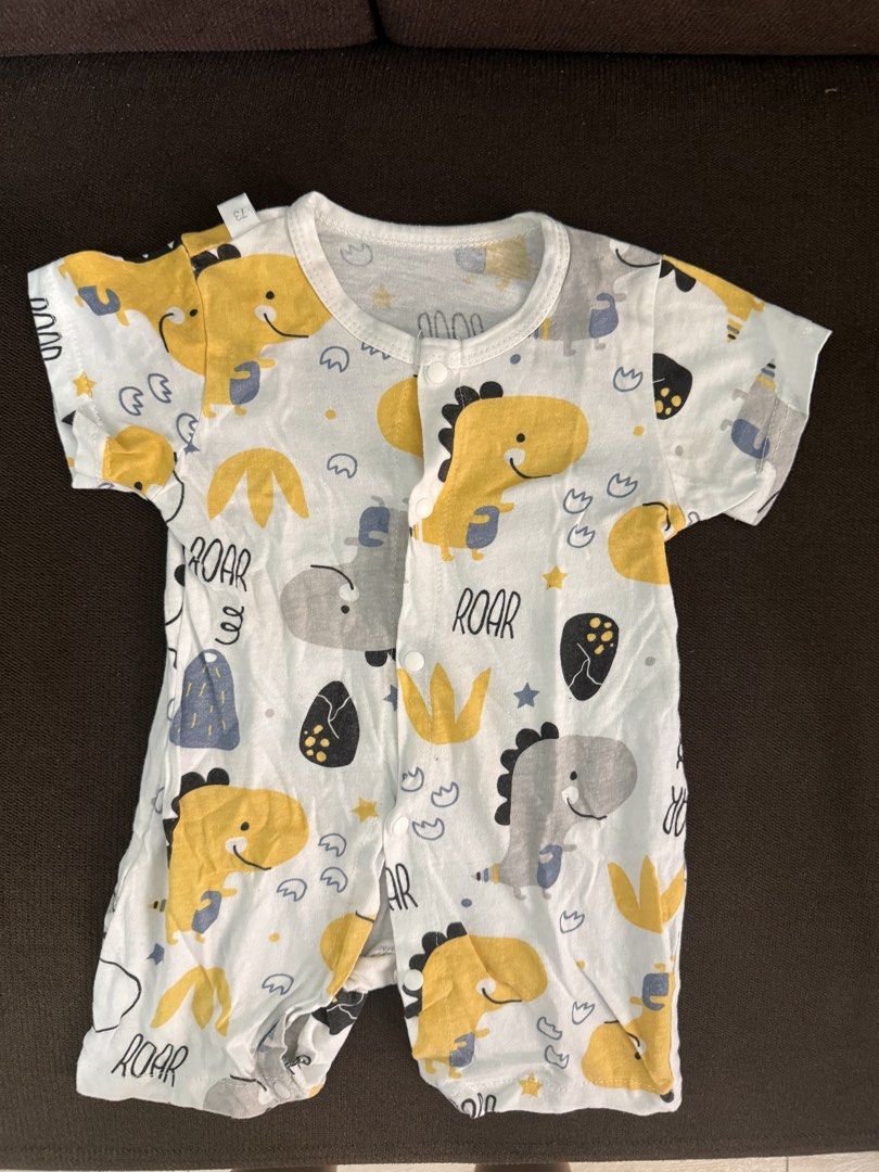 SHEIN Baby Dinosaur Romper "ROAR" Print (Category: Babies & Kids Fashion) located in Paranaque City. Submitted by trishloren0608 (Listing ID 1463338723, Image 1). Description: - Adorable baby romper with a fun dinosaur print. - Features 'ROAR' text and cute yellow and grey dinosaurs. - Short sleeves for comfort. - Easy snap button closure for quick dressing. - Perfect for little dino lovers! - Comfortable and playful design for everyday wear..