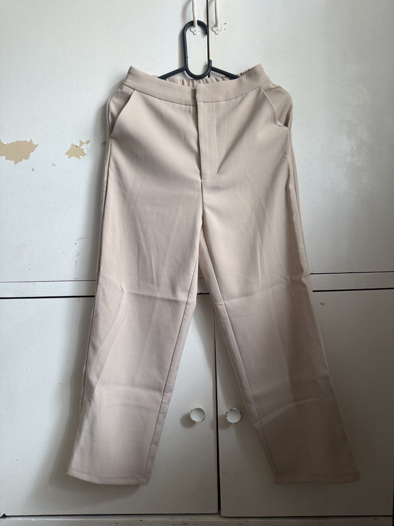 Shein LIKE COL Beige Wide Leg Pants (Category: Other Bottoms) located in Taguig. Submitted by anjielamarie_ (Listing ID 1463373492, Image 1). Description: - Beige wide leg pants - High-waisted style - Made from polyester and elastane blend - Fully lined for comfort - Versatile for work or casual outfits - Comfortable fit.