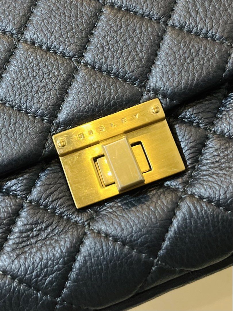 SISLEY Quilted Chain Shoulder Bag (Category: Shoulder Bags) located in Bacolod City. Submitted by vintage_vogue6100 (Listing ID 1463388663, Image 3). Description: - Black quilted leather shoulder bag - Elegant gold chain strap - Secure gold turn-lock closure - Classic flap design - Ideal for evenings or dressing up your look - Spacious enough for your essentials.