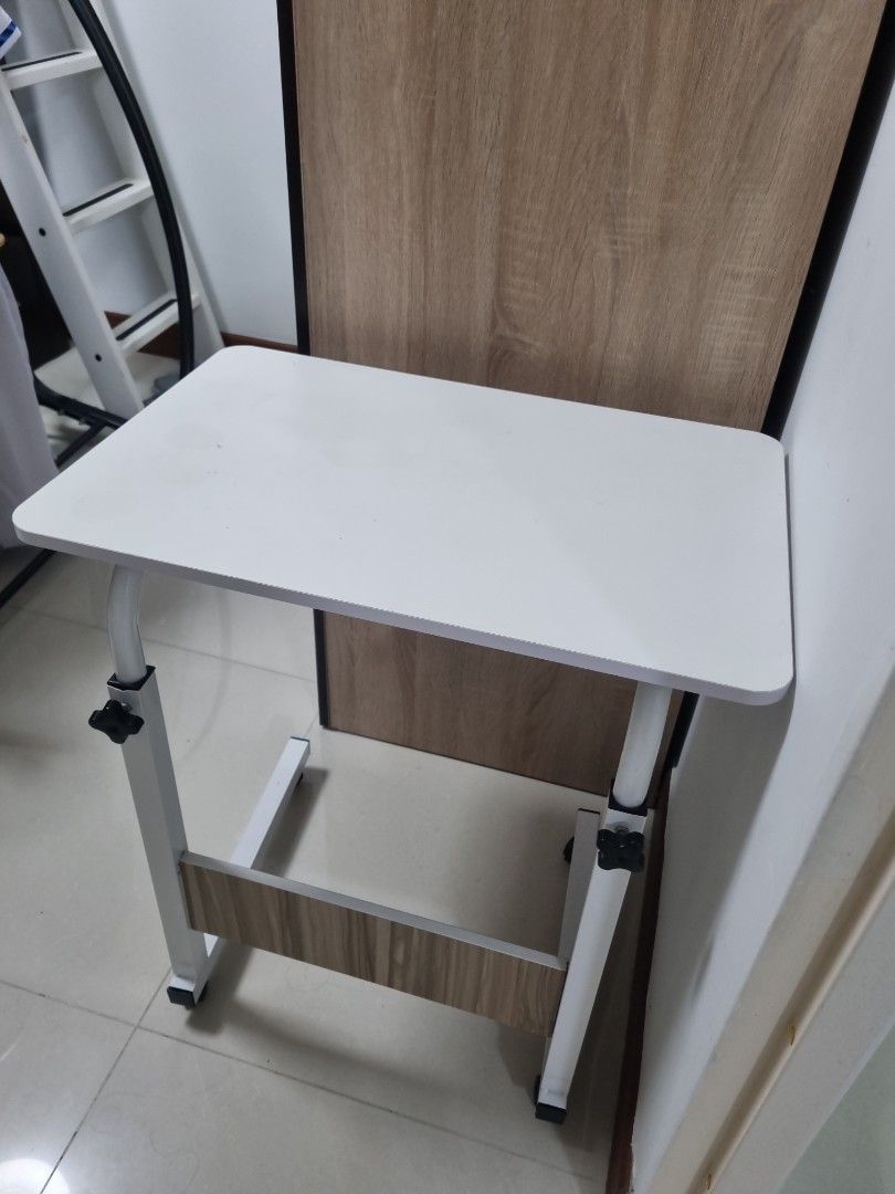 Small table (Category: Tables & Sets) located in Singapore. Submitted by yeohmint (Listing ID 1463340247, Image 1). Description: can adjust height table size 60cm x 40cm.