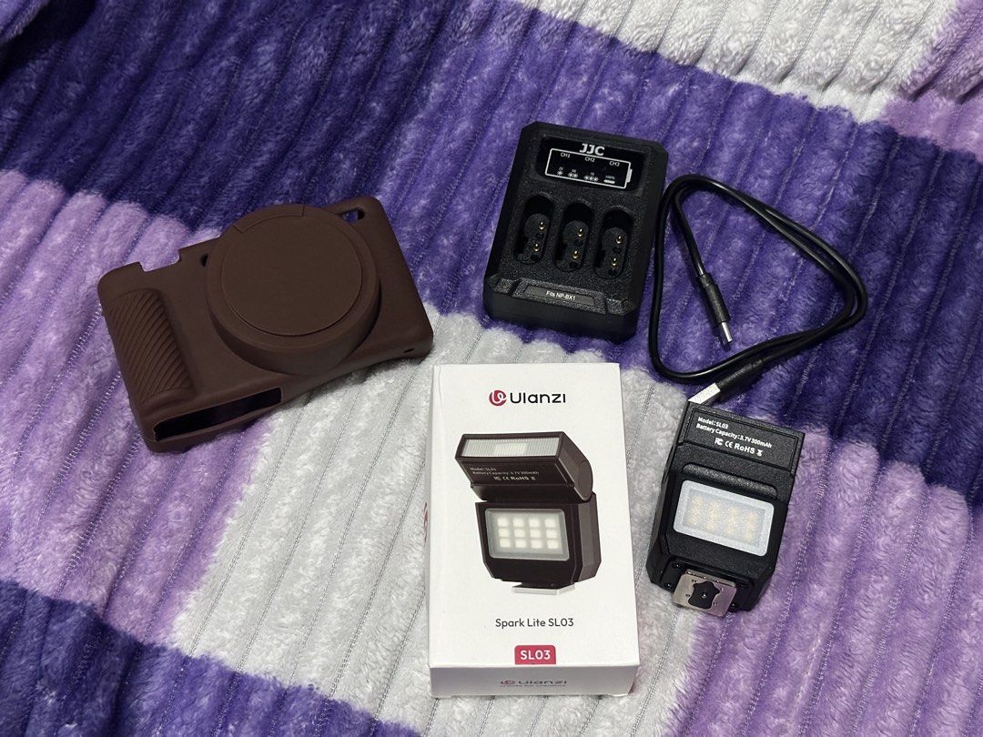 Sony ZV1 Accessories (Category: Other Photography Accessories) located in San Fernando. Submitted by nishsh_ (Listing ID 1463498685, Image 1). Description: - Ulanzi Spark Lite SL03 LED light - JJC NP-BX1 battery charger with USB cable - Brown silicone camera case -All for Sony ZV1 -Ulanzi & JJC Charger are both working -LIKE NEW (2 weeks palang nasa akin) -RFS: sold the cam. buyer shoulder sf Mode of Payment: Bank Transfer (BPI/ Maribank) GCash.