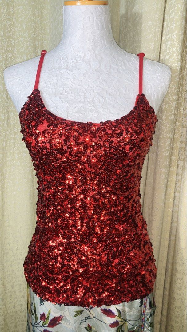 Sparkly Red Sequin Tank Top Camisole (Category: Sleeveless) located in Dagupan City. Submitted by sj_styles0910. (Listing ID 1463533125, Image 1). Description: - Stunning red sequin tank top - Delicate spaghetti straps - Fully sequined front for maximum sparkle - Solid red back with a subtle sheen - Ideal for parties, nights out, or any occasion needing glamour - Designed to catch the light beautifully - Comfortable for all-night wear.