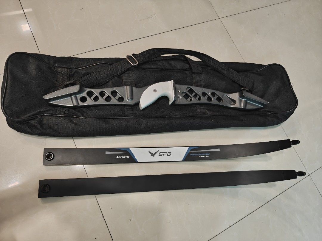 SPG Archery Recurve Bow Set with Bag (Category: Other Sports Equipment and Supplies) located in Taytay. Submitted by mackmenow (Listing ID 1463341163, Image 2). Description: - SPG Recurve Bow Set - Ideal for beginners! - Includes: 25" Riser, 68" 18lbs. limbs, and a black carrying bag. - Riser features a grey finish with a comfortable white grip. - Great starter kit for your archery journey..