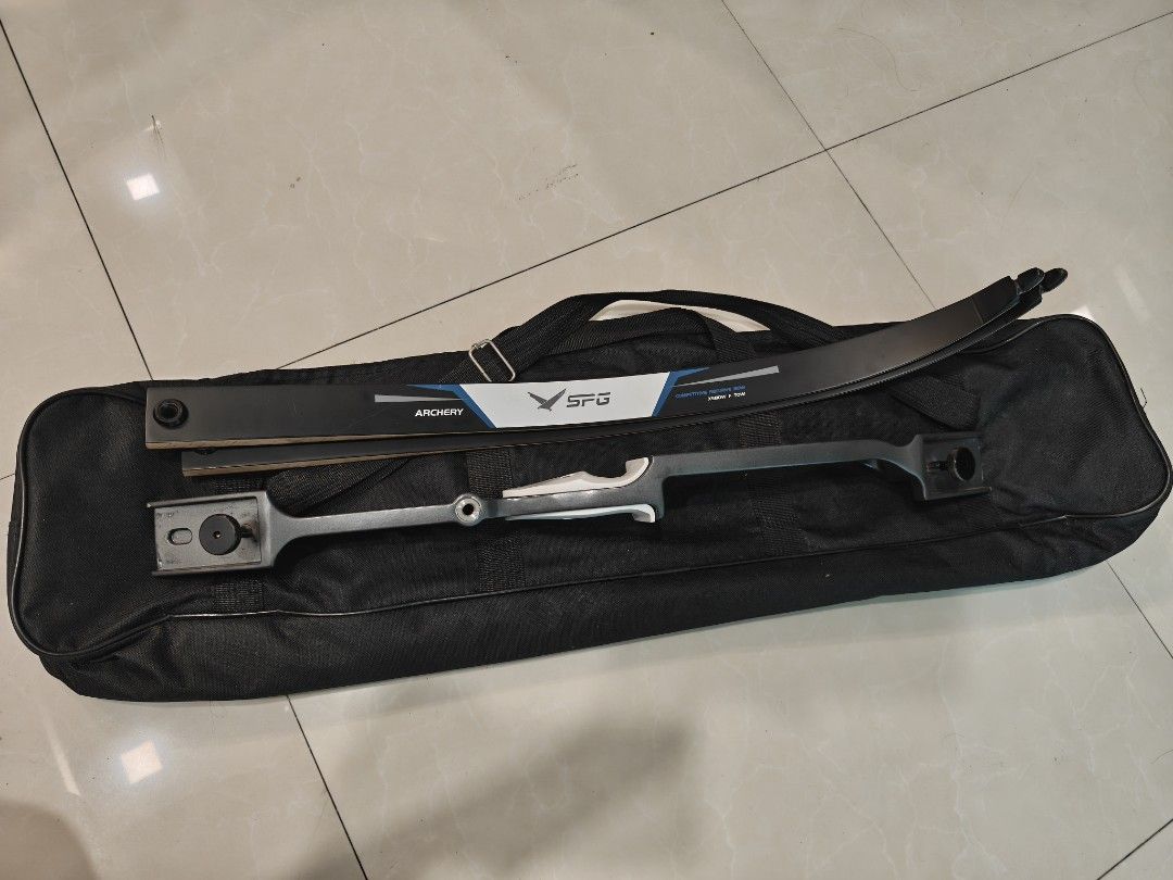 SPG Archery Recurve Bow Set with Bag (Category: Other Sports Equipment and Supplies) located in Taytay. Submitted by mackmenow (Listing ID 1463341163, Image 1). Description: - SPG Recurve Bow Set - Ideal for beginners! - Includes: 25" Riser, 68" 18lbs. limbs, and a black carrying bag. - Riser features a grey finish with a comfortable white grip. - Great starter kit for your archery journey..