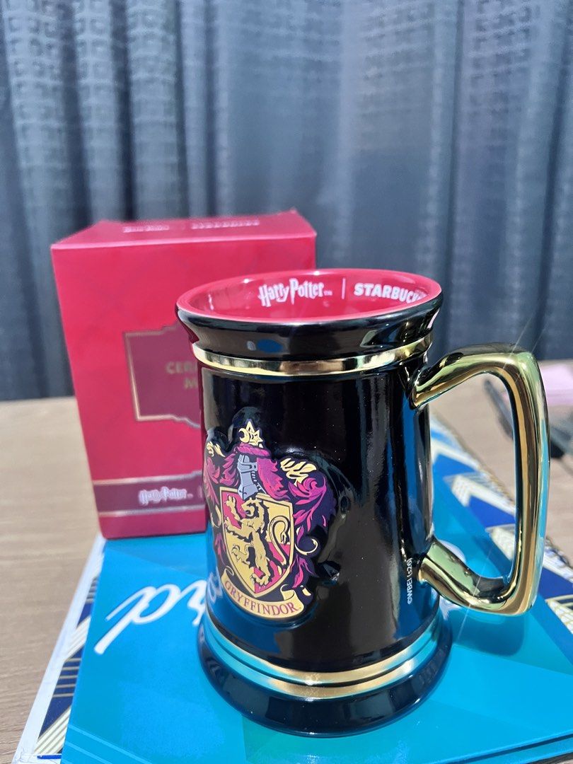 Starbucks Harry Potter Gryffindor Mug with Box (Category: Coffee & Tea Tableware) located in Manila. Submitted by cleverstone_21f597 (Listing ID 1463327781, Image 3). Description: - Authentic Starbucks Harry Potter Gryffindor Mug - Features the iconic Gryffindor crest in gold accents on a black mug - Comes with its original, collectible red box - Ideal for any Harry Potter enthusiast or mug collector - Perfect for enjoying your favorite hot bever
