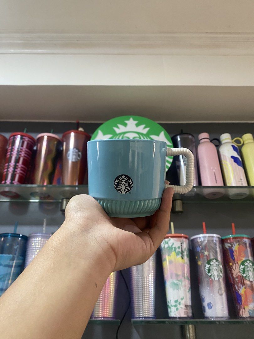 Starbucks mugs Tiffany color (Category: Water Bottles & Tumblers) located in Paranaque City. Submitted by jayisnottyfound (Listing ID 1463409831, Image 1). Description: - Brand: Starbucks - Color: Tiffany Blue - Design: Classic Starbucks logo with ribbed base and woven-style handle - Condition: Excellent, like new - Perfect for coffee, tea, or as a collectible.