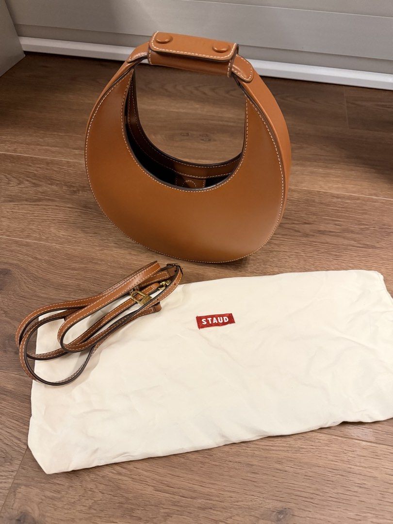 AUTHENTIC Staud mini Moon Bag Tan Leather (Category: Shoulder Bags) located in Cebu City. Submitted by chicandcasualx (Listing ID 1463462563, Image 3). Description: STAUD Mini Moon Bag in Tan 🤎 Selling for ₱18,000. Comes with the removable crossbody strap and original STAUD dust bag. A beautiful structured bag you can carry by hand or wear crossbody. Please see photos for condition. Message me for more details or photos. RFS: Decluttering Paymen