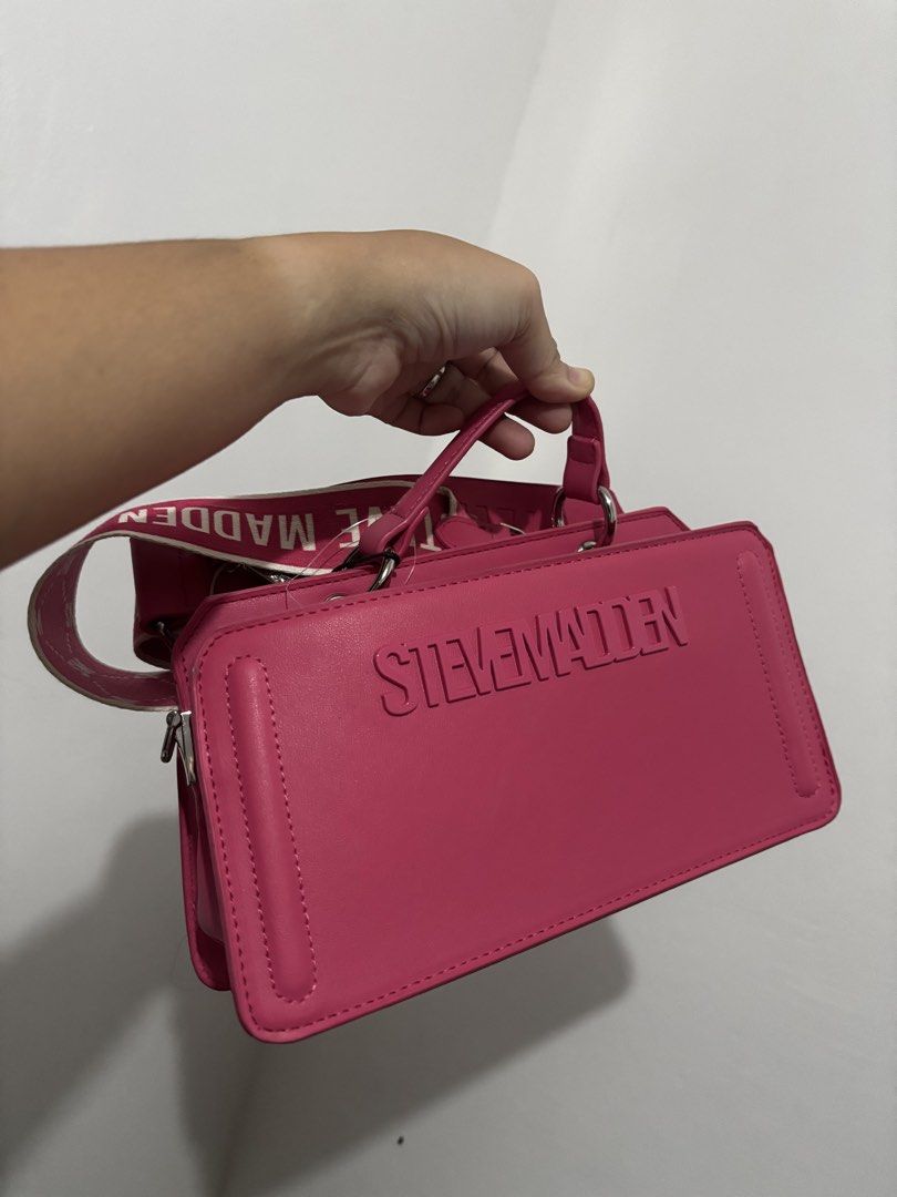 Steve Madden Pink Crossbody Handbag (Category: Cross-body Bags) located in Manila. Submitted by bentaandco (Listing ID 1463496905, Image 1). Description: Brand New with Tag, Unused Bought from US Can be worn crossboday or as handbag Pick up: Cabuyao Laguna MOP: Gcash/Bank Transfer.