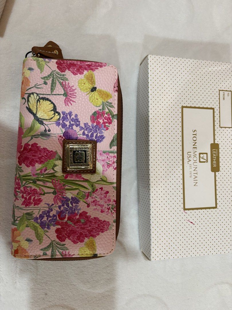 Stone Mountain Leather Floral Zip Around Wallet (Category: Wallets & Card holders) located in Manila. Submitted by dig76 (Listing ID 1463357082, Image 2). Description: - Cute Stone Mountain wallet - Lovely floral and butterfly design on a pink background - Secure zip-around closure - Multiple card slots and compartments for organization - Comes with original box.