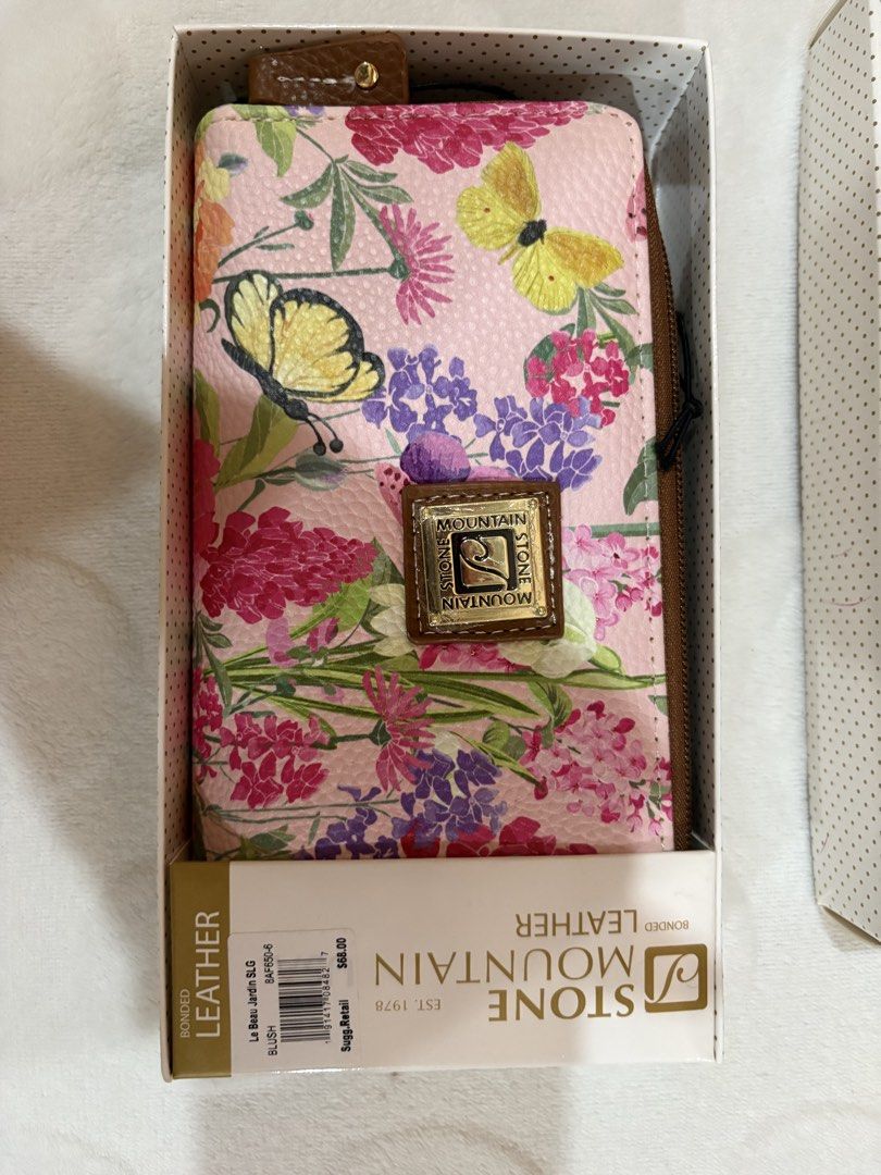 Stone Mountain Leather Floral Zip Around Wallet (Category: Wallets & Card holders) located in Manila. Submitted by dig76 (Listing ID 1463357082, Image 1). Description: - Cute Stone Mountain wallet - Lovely floral and butterfly design on a pink background - Secure zip-around closure - Multiple card slots and compartments for organization - Comes with original box.