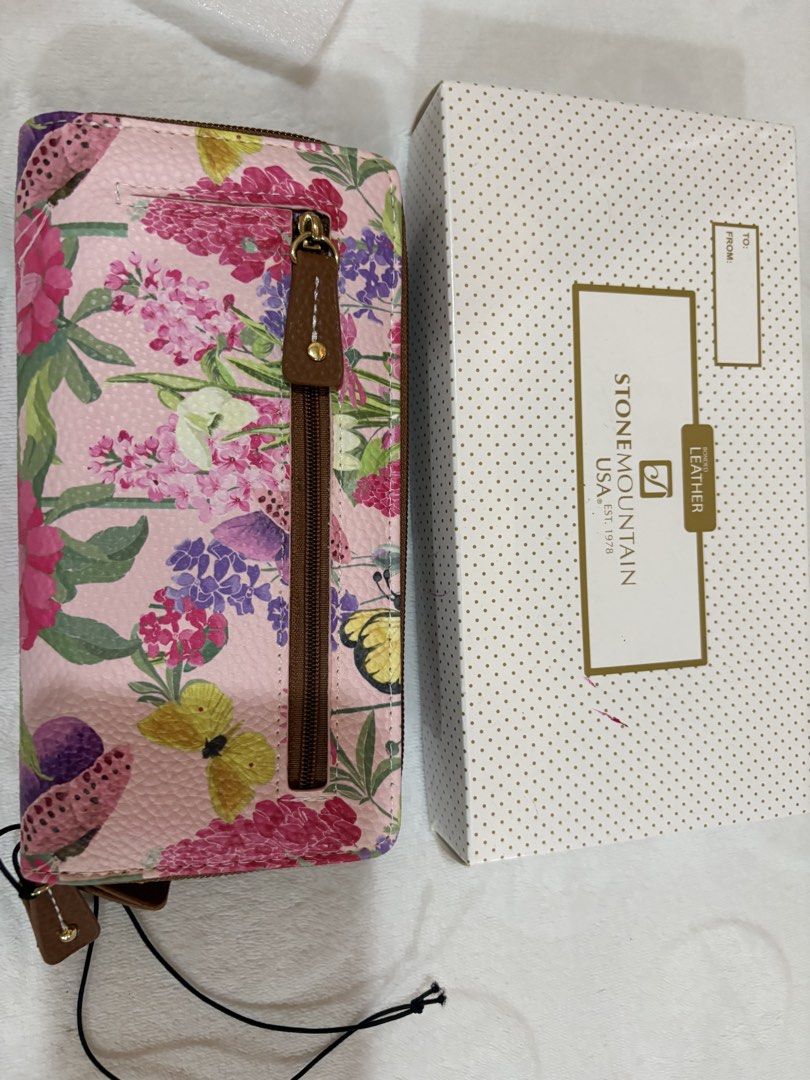 Stone Mountain Leather Floral Zip Around Wallet (Category: Wallets & Card holders) located in Manila. Submitted by dig76 (Listing ID 1463357082, Image 3). Description: - Cute Stone Mountain wallet - Lovely floral and butterfly design on a pink background - Secure zip-around closure - Multiple card slots and compartments for organization - Comes with original box.