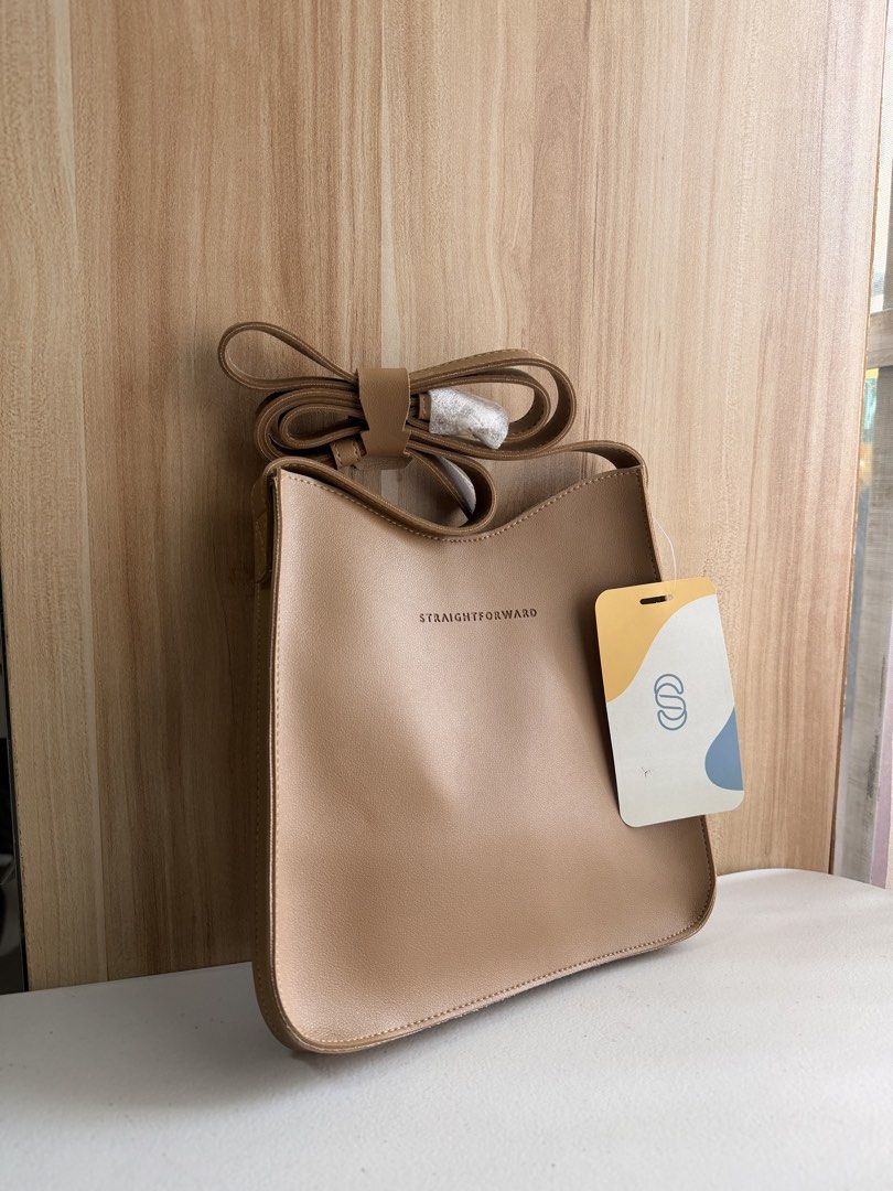 Straightforward Boundless Basics Sling Bag - Beige (Category: Cross-body Bags) located in Manila. Submitted by mondaymom (Listing ID 1463370421, Image 1). Description: - Brand: Boundless Basics - Color: Beige - Style: Chic sling bag - Features: Adjustable strap - Ideal for: Everyday use - Condition: Comes with original tag - Measurements: Approx. 23cm (Width) x 26cm (Height).