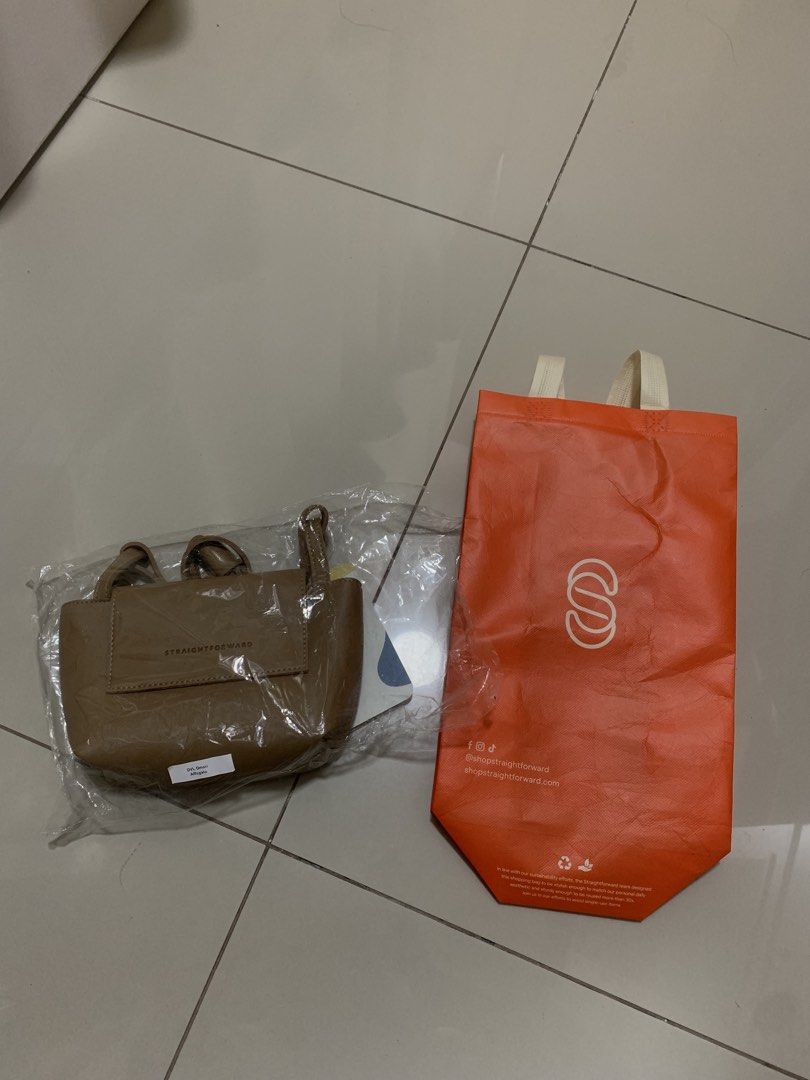 Straightforward Boundless Basics Tote Bag (Category: Tote Bags) located in Cavite. Submitted by schnauzerthecutie (Listing ID 1463509418, Image 1). Description: - Straightforward Boundless Basics tote bag - Color: Taupe - Condition: Brand new, in original packaging - Includes: Orange Straightforward reusable bag - Ideal for: Everyday use.