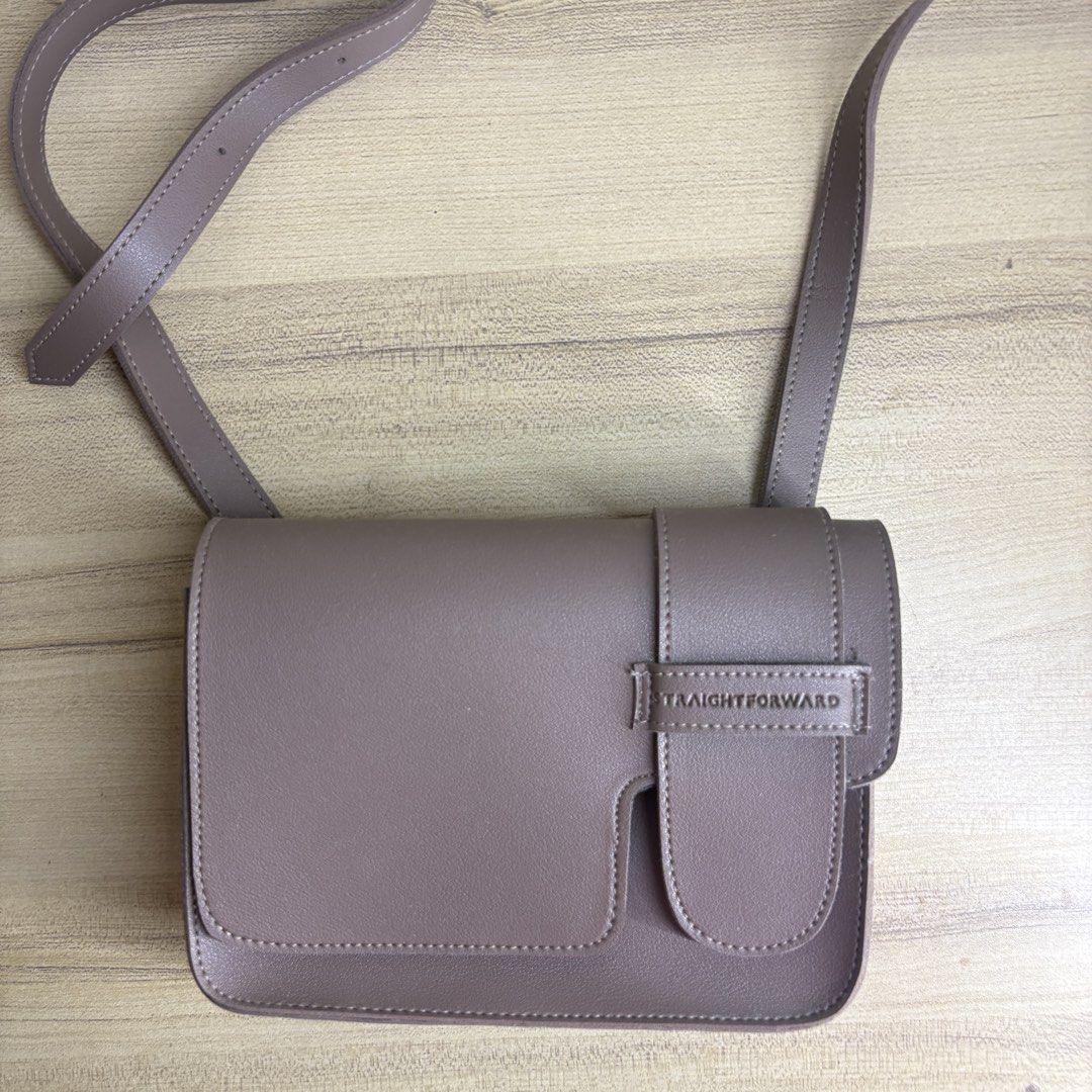 Straightforward Taupe Crossbody Bag (Category: Cross-body Bags) located in Angeles City. Submitted by muse_archive (Listing ID 1463434300, Image 2). Description: - Taupe crossbody bag from Straightforward - Main compartment and smaller front pocket - Magnetic snap closures - Adjustable strap .