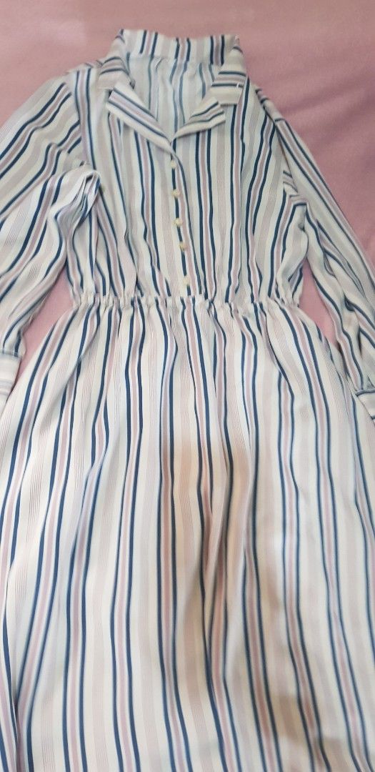 Striped Button-Up Long Sleeve Dress (Category: Dresses) located in Quezon City. Submitted by seventeenjeonghan (Listing ID 1463352127, Image 2). Description: - Chic striped button-up dress - Flattering elasticated waist - Long sleeves with button cuffs - Fabric with a subtle sheen - Versatile for casual to semi-formal occasions.