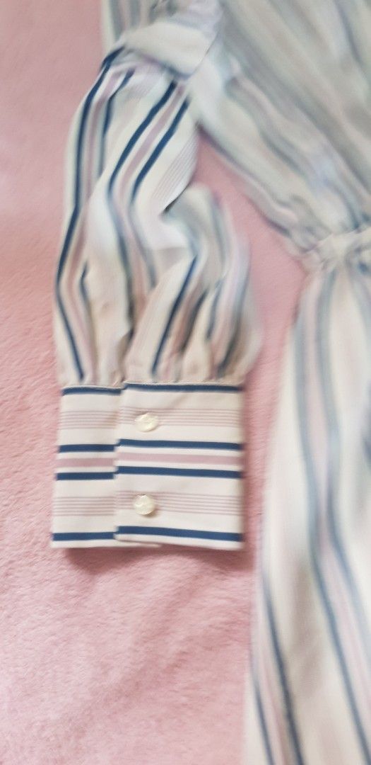 Striped Button-Up Long Sleeve Dress (Category: Dresses) located in Quezon City. Submitted by seventeenjeonghan (Listing ID 1463352127, Image 3). Description: - Chic striped button-up dress - Flattering elasticated waist - Long sleeves with button cuffs - Fabric with a subtle sheen - Versatile for casual to semi-formal occasions.