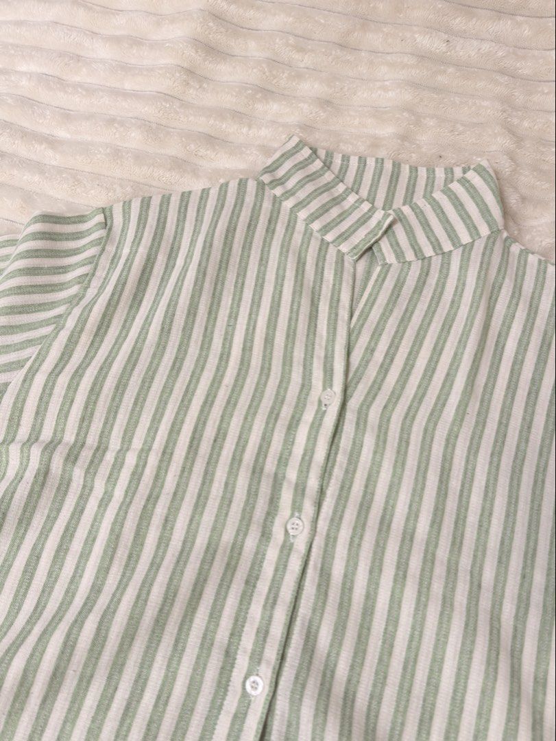 Striped Button-Up Shirt (Category: Tshirts & Polo Shirts ) located in Rizal. Submitted by rianaht (Listing ID 1463399240, Image 3). Description: Classic green and white stripe pattern - Can fit Medium to Large 🌸 RFS: Decluttering 🌸 Delivery only to be shouldered by the buyer. 🌸 Payment via GCash / Maya / Maribank.