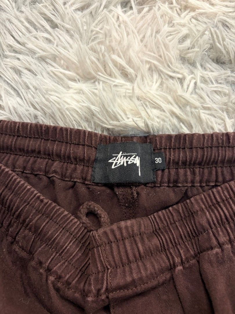 Stussy Brown Cargo Shorts Size 30 (Category: Shorts) located in Manila. Submitted by glenndejes07057 (Listing ID 1463513860, Image 2). Description: - Brand: Stussy - Color: Brown - Size: 30 - Material: 97% Cotton, 3% Spandex - Features: Elastic waistband with drawstring, two side pockets, two back pockets - Detail: Frayed hem.