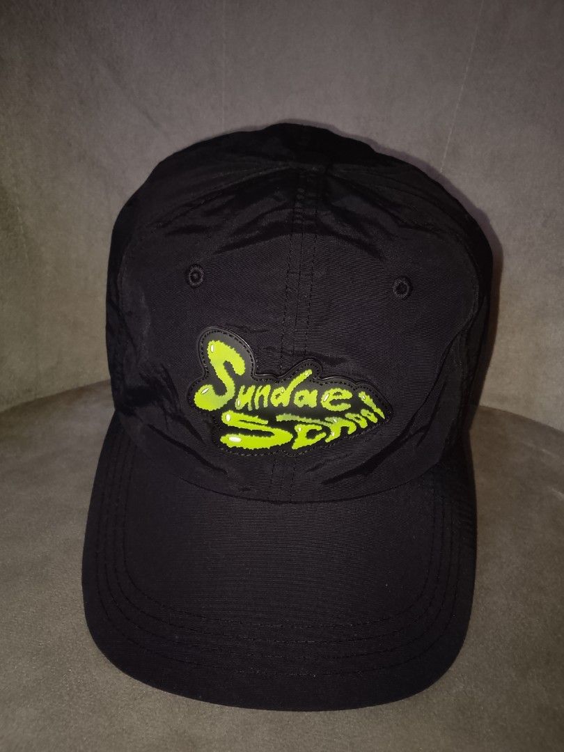 Sundae School Neon Slime Logo Black Nylon Strapback Hat (Category: Caps & Hats) located in Binangonan. Submitted by yuristalin888 (Listing ID 1463345183, Image 2). Description: Elevate your streetwear game with this ultra-cool strapback cap from Sundae School. Crafted from sleek, lightweight 100% black nylon, this hat features an eye-catching neon yellow 3D slime logo that glows with main character energy. It includes a custom "Sundae School" lab