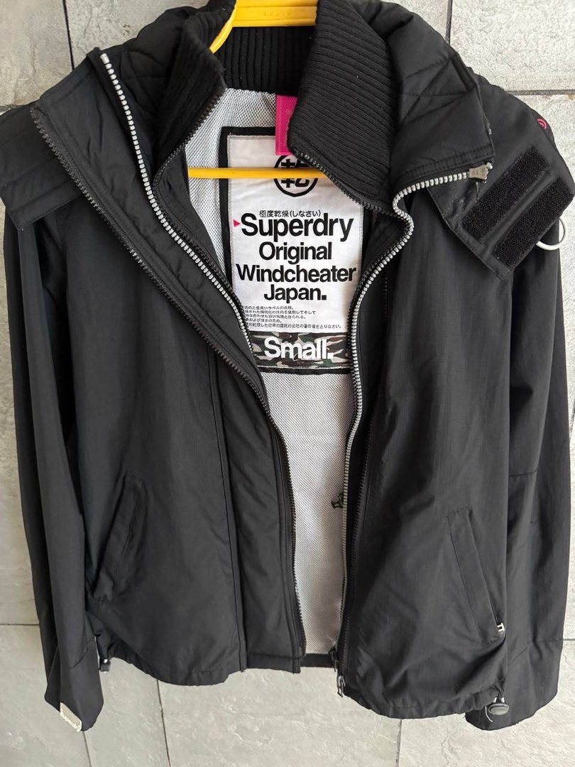 Superdry Original Windcheater Japan Black Jacket (Category: Coats, Jackets and Outerwear) located in Taguig. Submitted by anxmz (Listing ID 1463465139, Image 1). Description: - Superdry Original Windcheater Jacket (Japan Edition) - Color: Black - Size: Small - Features: Hood, Zip-up front, Mesh lining - Ideal for: Windy days - Condition: Gently used, selling because it's no longer worn..