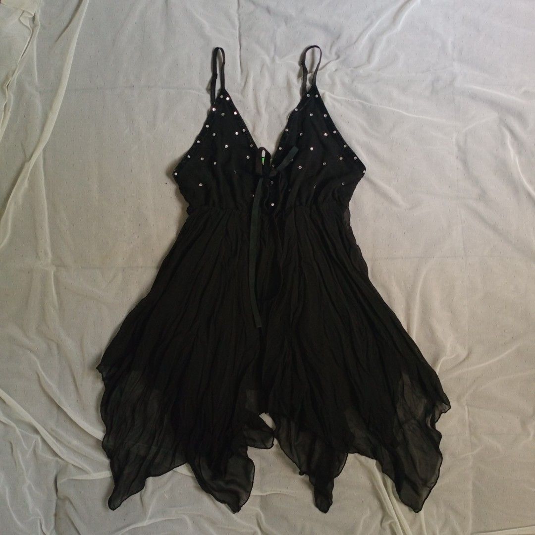 Sword Fish Black Sequin Fairy Top (Category: Dresses) located in Manila. Submitted by electricpetals (Listing ID 1463449195, Image 1). Description: - Brand: Sword Fish - Size: S - Color: Black - Neckline: V-neck - Straps: Adjustable - Details: Small silver sequins on bust, front tie detail - Hemline: Flowy and uneven.