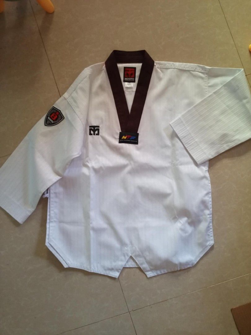 TAEKWONDO BLACK COLLAR DOBOK (Category: Other Sports Equipment and Supplies) located in San Fernando. Submitted by avylll_thrift (Listing ID 1463378659, Image 2). Description: MOOTO BLACK COLLAR DOBOK BRANDNEW HAS SLIGHT FADING NECKLINE BECAUSE NA STOCK TOP 140 PANTS 150.