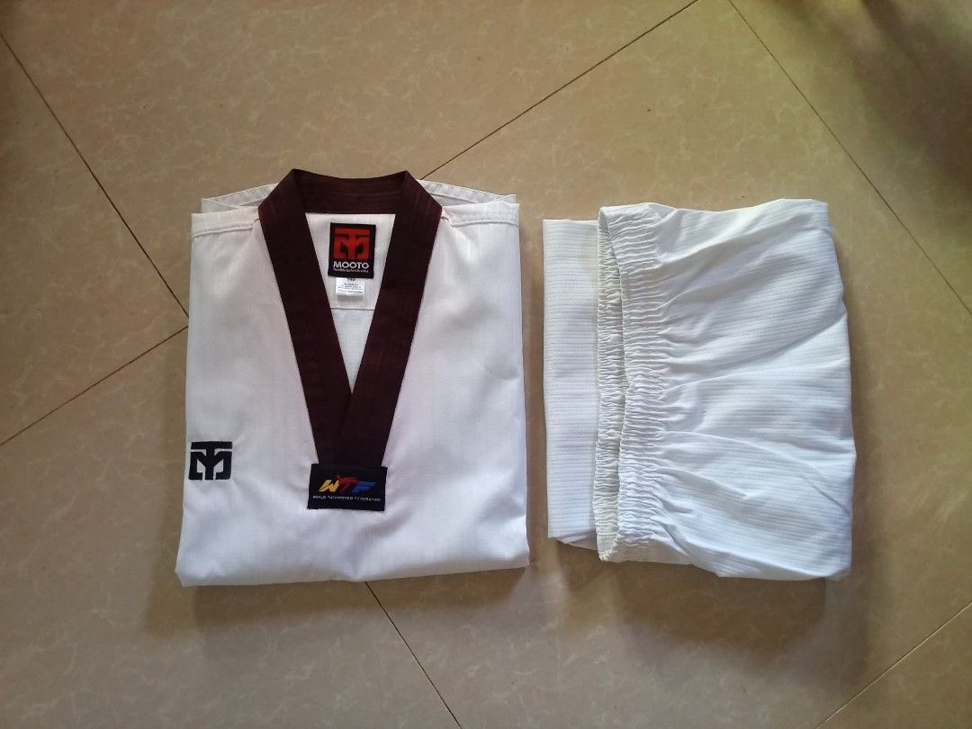 TAEKWONDO BLACK COLLAR DOBOK (Category: Other Sports Equipment and Supplies) located in San Fernando. Submitted by avylll_thrift (Listing ID 1463378659, Image 1). Description: MOOTO BLACK COLLAR DOBOK BRANDNEW HAS SLIGHT FADING NECKLINE BECAUSE NA STOCK TOP 140 PANTS 150.