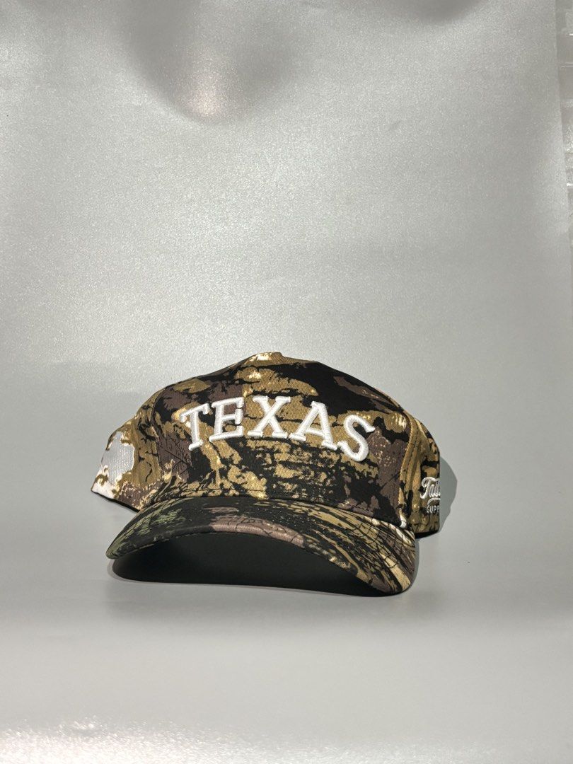 Tailspin Supply Co. Texas Camo Baseball Cap (Category: Caps & Hats) located in Manila. Submitted by gilmorecapz (Listing ID 1463442014, Image 2). Description: - Authentic Tailspin Supply Co. Texas cap - Stylish camouflage pattern - 'TEXAS' embroidered on the front - Proudly made in Austin, Texas - Adjustable strap for a comfortable, custom fit - Ideal for any Texas enthusiast or fan.