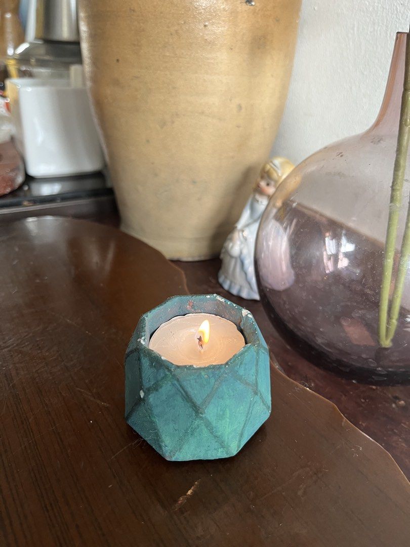 Tealight Candle in Geometric Teal Holder (Category: Other Home Decor) located in Taguig. Submitted by minmin_parker (Listing ID 1463422689, Image 3). Description: - Cute tealight candle - Dark teal geometric holder with diamond pattern - Nice size for desk or small table - Creates a cozy ambiance - Perfect as a gift or for your own home.