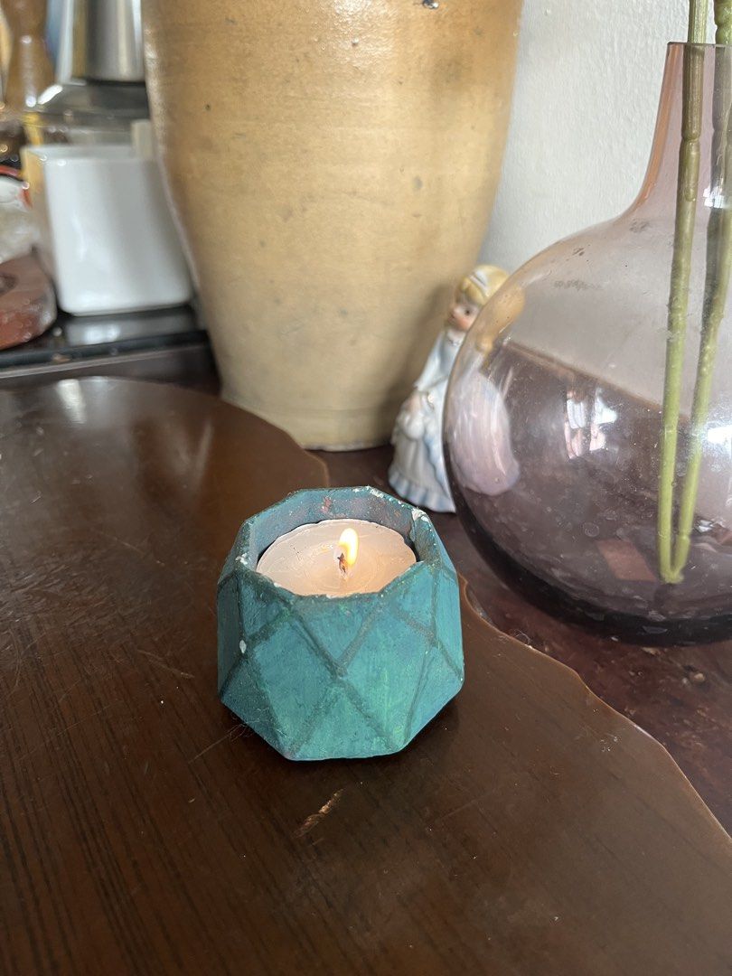 Tealight Candle in Geometric Teal Holder (Category: Other Home Decor) located in Taguig. Submitted by minmin_parker (Listing ID 1463422689, Image 2). Description: - Cute tealight candle - Dark teal geometric holder with diamond pattern - Nice size for desk or small table - Creates a cozy ambiance - Perfect as a gift or for your own home.