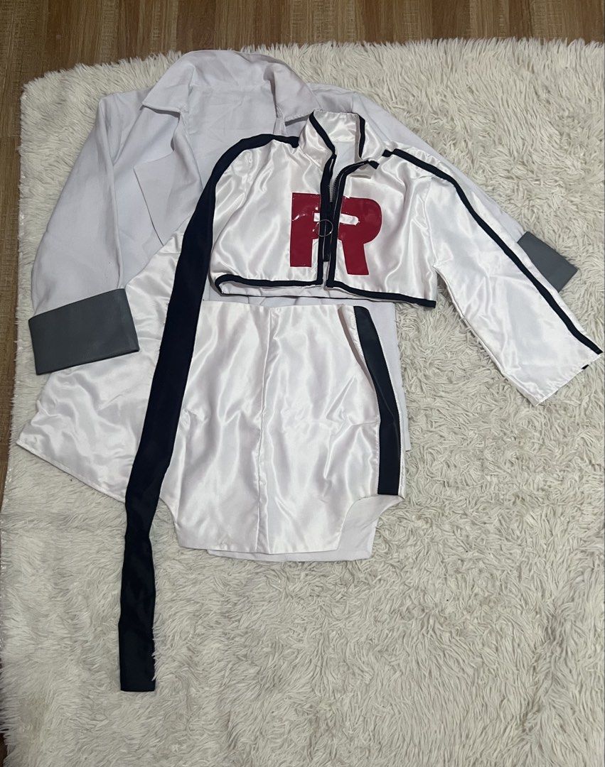 Team Rocket pokemon jessie cosplay (Category: Dresses) located in Alburquerque. Submitted by baozi_bao (Listing ID 1463382903, Image 1). Description: - Team Rocket inspired cosplay set - Includes: cropped jacket with 'R' logo, high-waisted skirt, white lab coat with grey cuffs -size small.