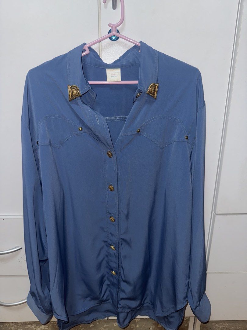 Terry Paris Gold Embellishments Button down (Category: Shirts) located in Manila. Submitted by quintessesommerset (Listing ID 1463441921, Image 1). Description: - Blue long-sleeved button-up shirt - 23.5x28 - Elegant gold button details - Decorative gold accents on collar - Classic western-style chest stitching - Perfect for casual or dressed-up looks.