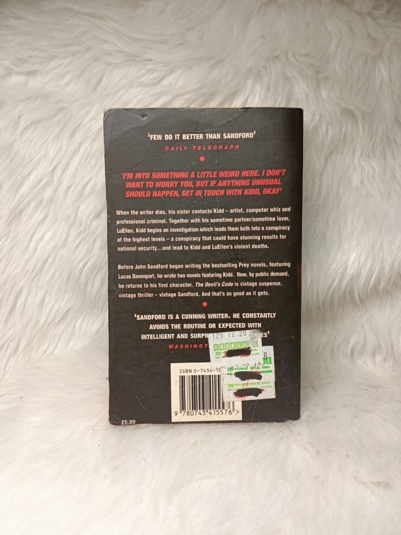 The Devil's Code by John Sandford - A Kidd Novel (Category: Storybooks) located in Tumauini. Submitted by qeynichi (Listing ID 1463327132, Image 2). Description: - Thriller novel by John Sandford - Title: 'The Devil's Code' (Kidd novel) - Plot: Conspiracy at the highest levels - Genre: Vintage thriller, suspense - Condition: Public domain, great read.