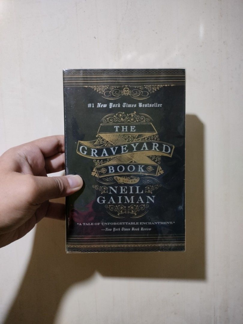 The Graveyard Book - Neil Gaiman (Category: Storybooks) located in Paranaque City. Submitted by _libryan (Listing ID 1463267275, Image 1). Description: Paperback in good condition, with visible shelf wear, spine creases, and foxing. Payment first via GCash. Delivery via Grab, Lalamove, GGX, or LBC COP. SF will be shouldered by the buyer. . . . Preloved Books Booksale Fantasy Middle Grade Halloween Fiction.