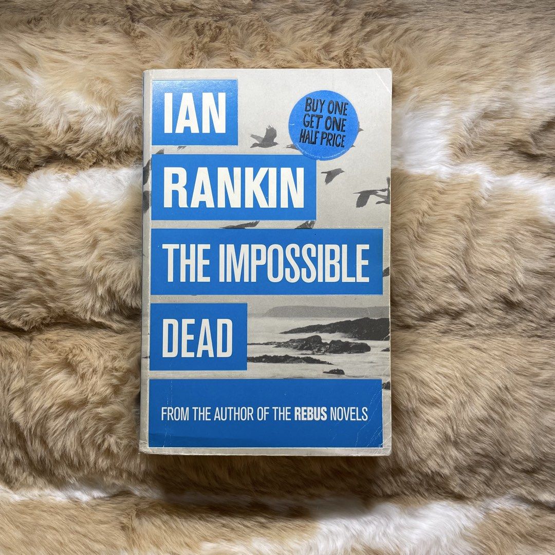 The Impossible Dead by Ian Rankin (Category: Storybooks) located in Valenzuela. Submitted by thrina_kira (Listing ID 1463345105, Image 1). Description: - Ian Rankin's 'The Impossible Dead' - From the author of the acclaimed Rebus novels - Features a 'Buy One Get One Half Price' sticker - Perfect for fans of crime fiction.
