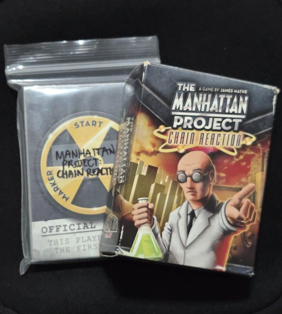 The Manhattan Project: Chain Reaction Board Game (Category: Board Games & Puzzles) located in Mandaluyong City. Submitted by 13amethyst (Listing ID 1463404836, Image 1). Description: Stand alone game based on the popular "Manhattan Project" board game by Minion Games, this is a simpler card-only game using dual-purpose cards in a quick and exciting race to completion. - complete and in great condition - cards are sleeved - 1-5 players - 20-25 min
