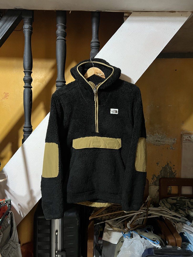The North Face Black Fleece Pullover (Category: Coats, Jackets and Outerwear) located in Butuan. Submitted by nikthrift. (Listing ID 1463334766, Image 1). Description: - Brand: The North Face - Type: Black fleece pullover - Accents: Tan zipper and pocket details - Material: 100% Polyester - Features: Great for layering, comfortable, warm - Ideal for: Outdoor activities or casual wear.
