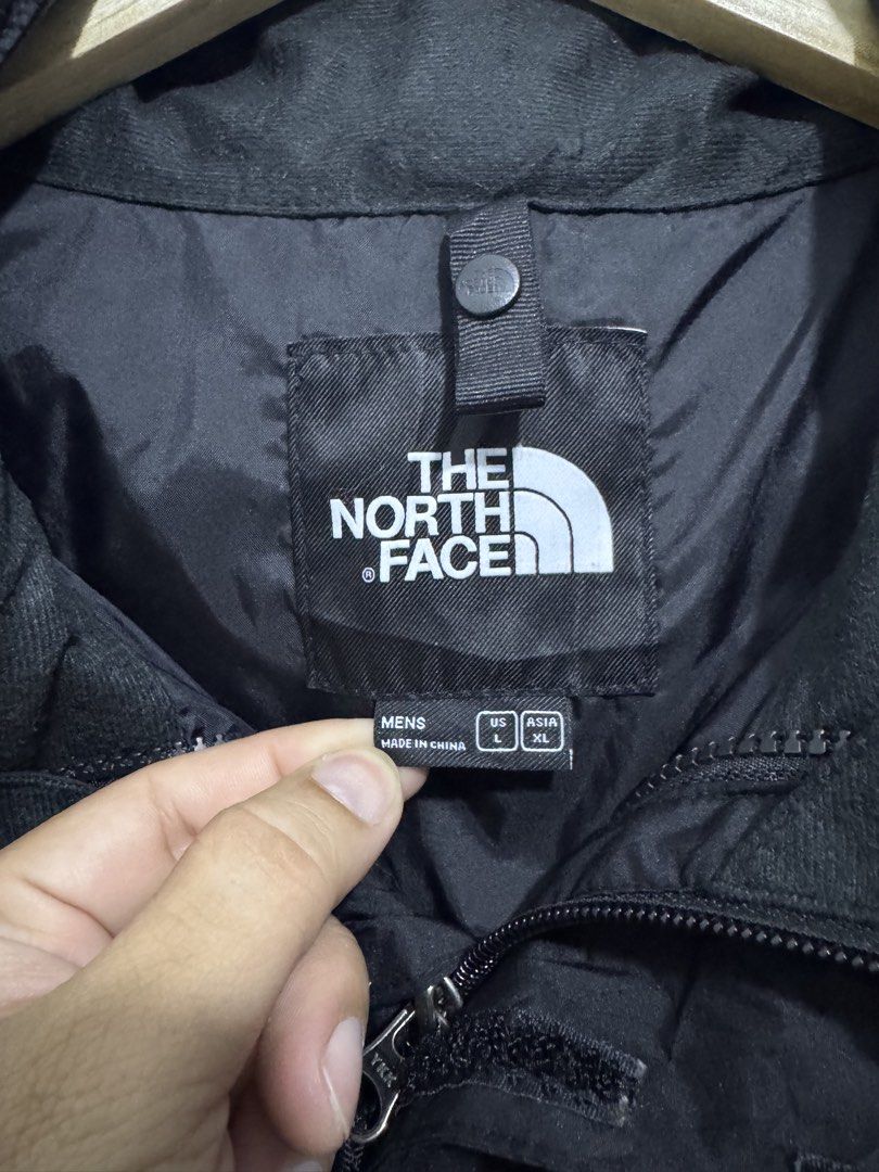 The North Face Black Hooded Jacket XL (Category: Coats, Jackets and Outerwear) located in Manila. Submitted by esparciake75752 (Listing ID 1463352962, Image 3). Description: - Brand: The North Face - Type: Hooded Jacket - Color: Black - Size: L / 23x28 - Material: 100% Nylon Shell, 100% Polyester Main Lining - Origin: Made in China - Features: Drawstrings at the hem - Ideal for: Outdoor activities.