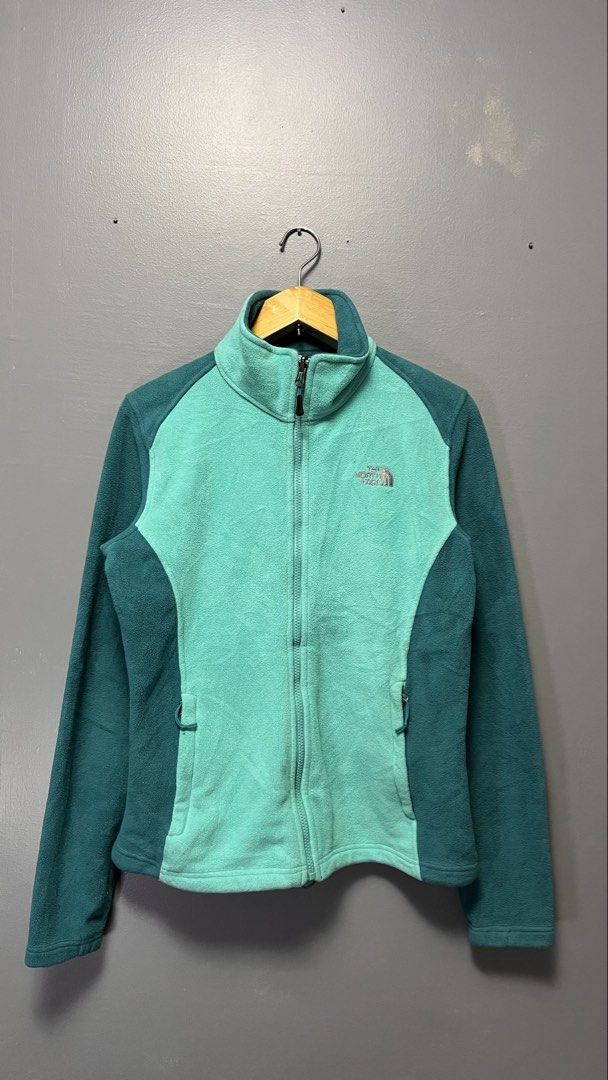 The North Face Fleece Jacket Teal Green (Category: Coats, Jackets and Outerwear) located in Cabuyao City. Submitted by bulandos (Listing ID 1463435877, Image 1). Description: - The North Face fleece jacket - Two-tone teal and green colorway - Full zip front with pockets - Made from 100% polyester - Perfect for layering, outdoor activities, or casual wear.