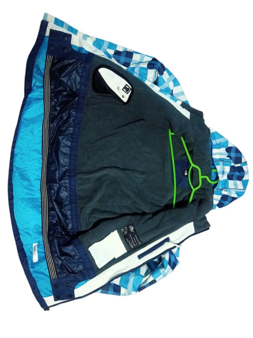The North Face Plaid Ski Jacket (Category: Coats, Jackets and Outerwear) located in Baguio. Submitted by vyner_hues (Listing ID 1463404472, Image 3). Description: - The North Face plaid ski jacket - Color: Blue, white, and navy checkered pattern - Features: Hooded, zip-up front, zippered pockets - Warmth: Inner fleece lining - Ideal for: Skiing or staying cozy.