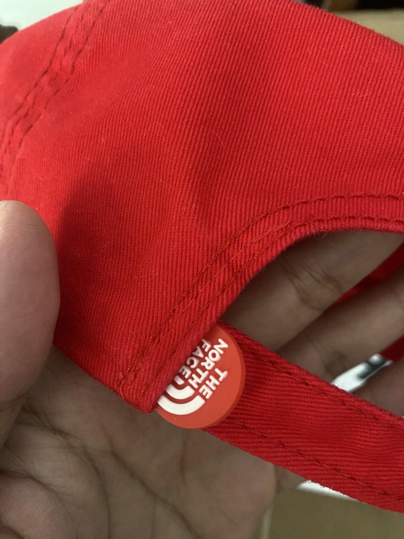 The North Face Simple Logo Cap Red (Category: Caps & Hats) located in Mangaldan. Submitted by startph (Listing ID 1463529232, Image 3). Description: - Brand: The North Face - Color: Red - Design: Simple logo - Strap: Adjustable with metal buckle - Condition: Brand new with tag attached - Origin: Made in China - Ideal for: Everyday wear.